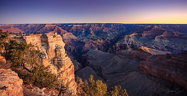 Layered canyon walls of the Grand Canyon, Arizona, in morning light.