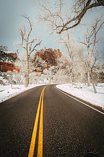 A vertical view of red sandstone rock and canyon shadow in Zion National Park, Utah.