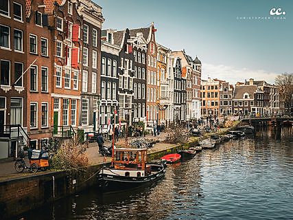 Canal houses lining a waterway in Amsterdam.