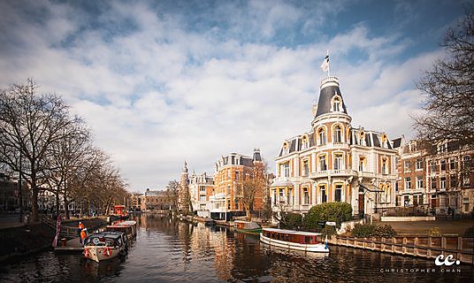 A canal and its houseboats in Amsterdam.