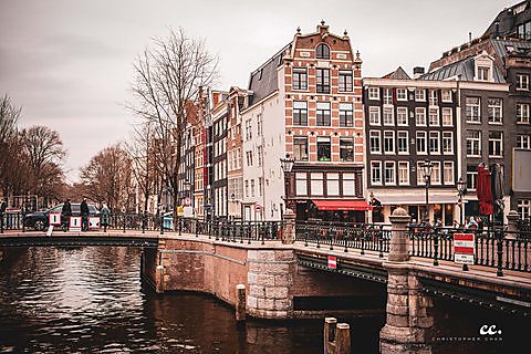 A canal and its houseboats in Amsterdam.